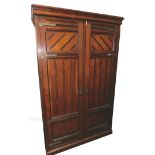 An Aesthetic style mahogany finish double door wardrobe, with moulded cornice raised above two panel