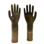 A pair of metal artificial hands, stamped serial nos 2L9J492 and 5M7F863.