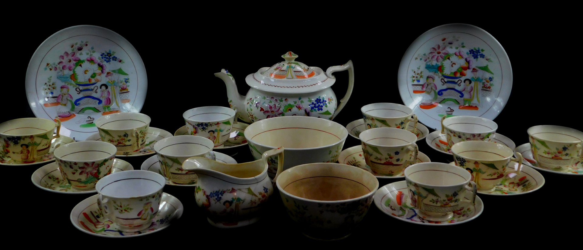 A Hilditch early 19thC porcelain part tea service, chinoiserie decorated with figures in a garden, c