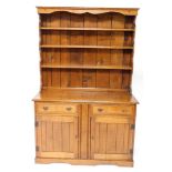An 18thC style oak dresser, of small proportion, the moulded cornice above a shaped frieze and three