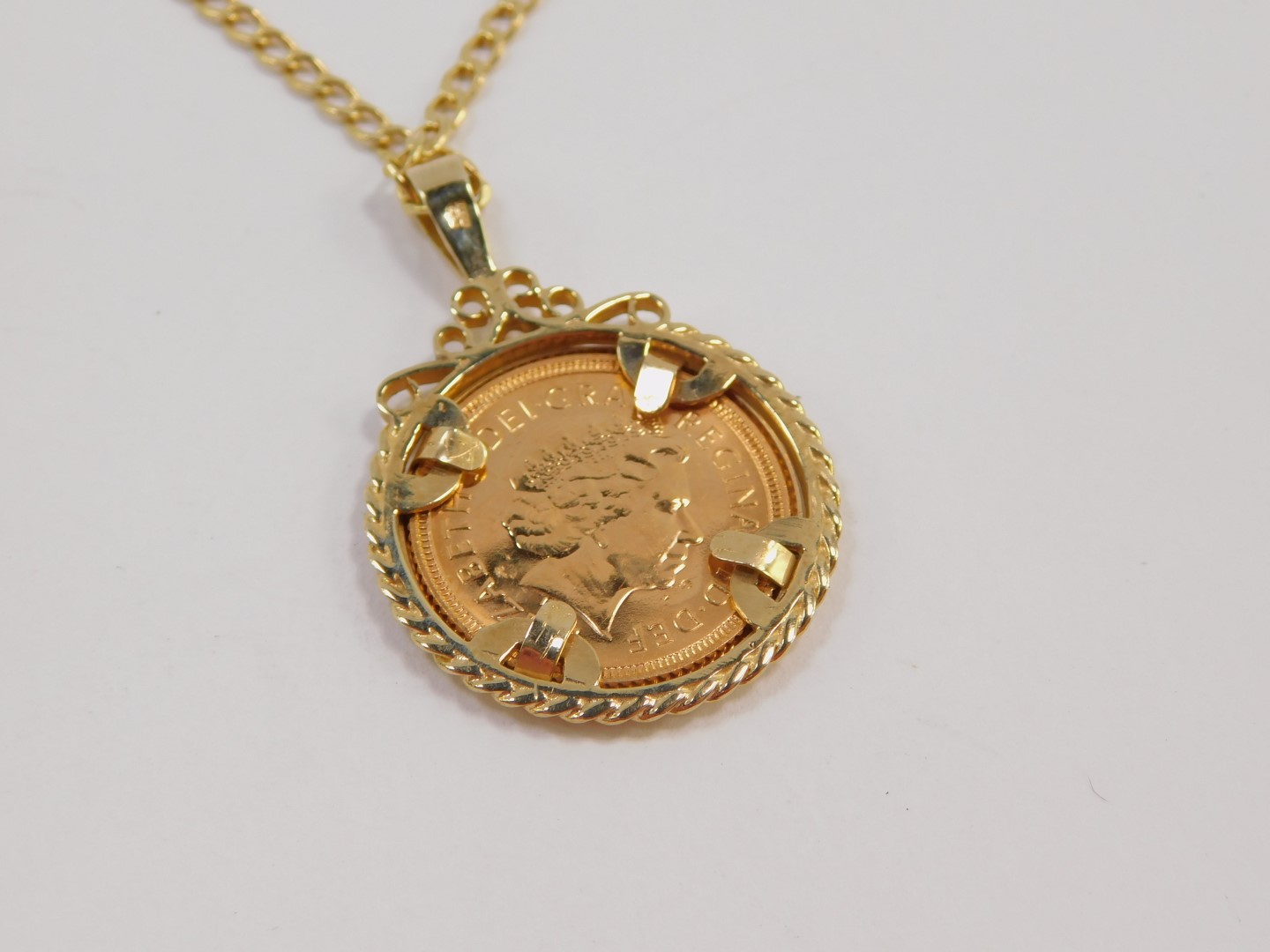 An Elizabeth II gold half sovereign 2000, 9ct gold pendant mounted on chain, 8.2g. - Image 3 of 4