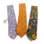 A Liberty blue silk tie, with Indian inspired decoration of animals and flowers, orange and green fl