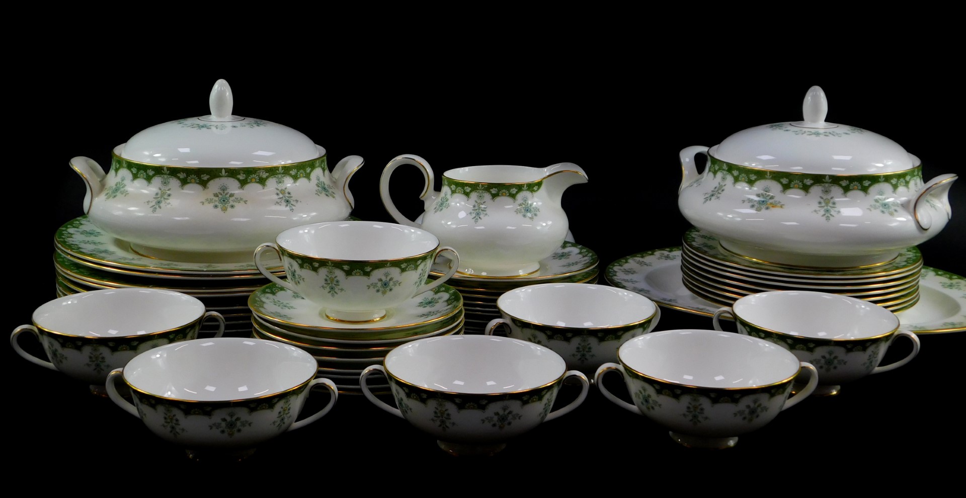 A Royal Doulton porcelain part dinner service decorated in the Ashmont pattern, comprising an oval m