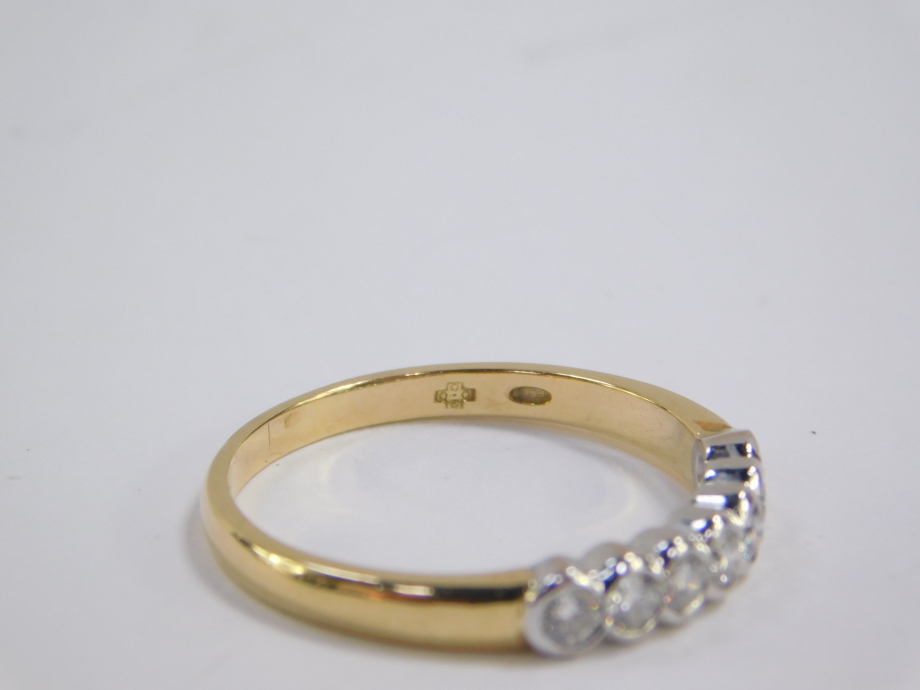 An 18ct gold and diamond seven stone half hoop eternity ring, approx 0.5cts, size Q, 3.7g. - Image 3 of 4