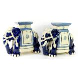 A pair of blue and white pottery garden seats modeled as elephants, in standing pose, 51cm wide.