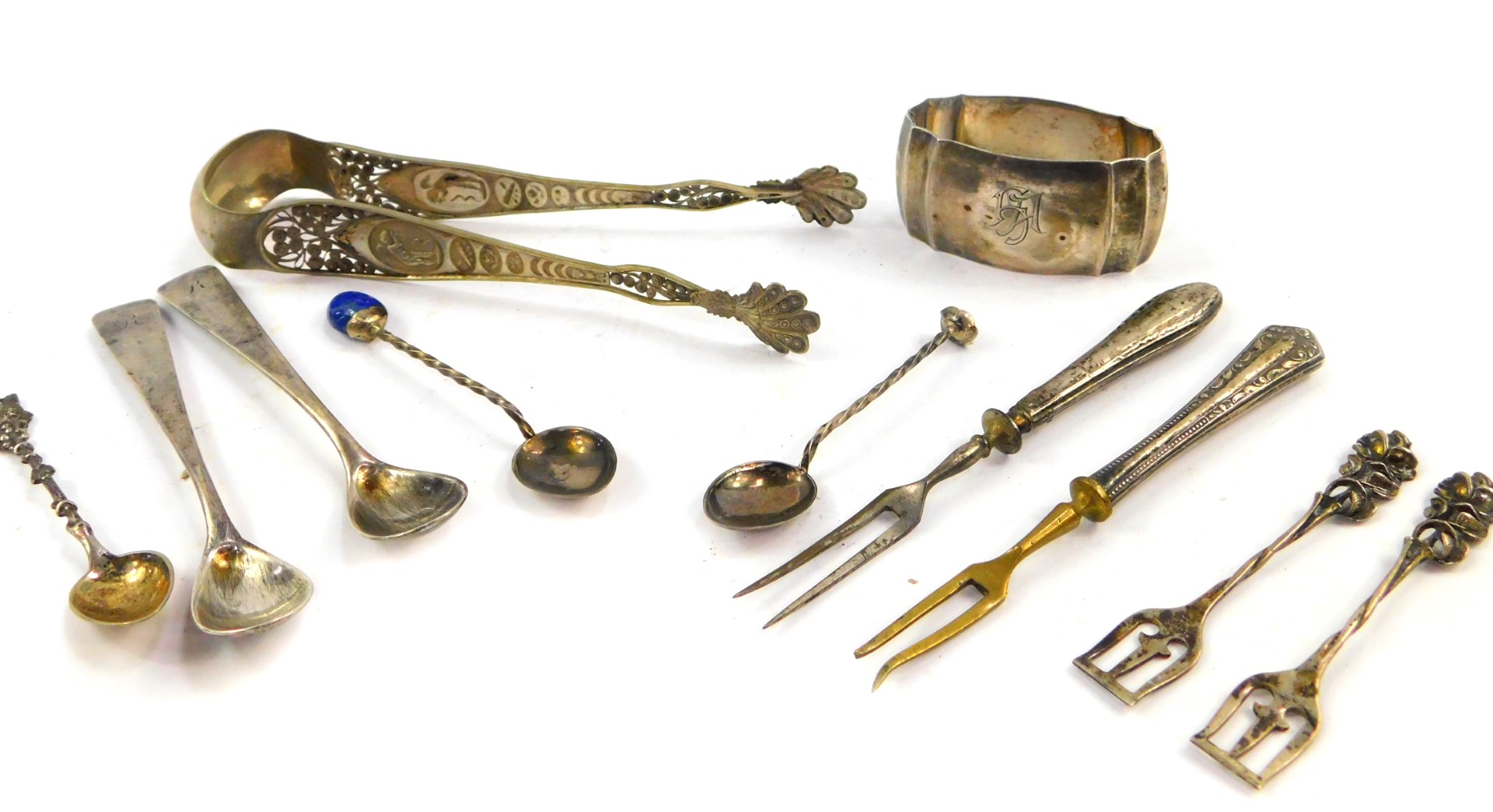 A pair of Continental sugar tongs, embossed with classical motifs and filigree work, a pair of sunda