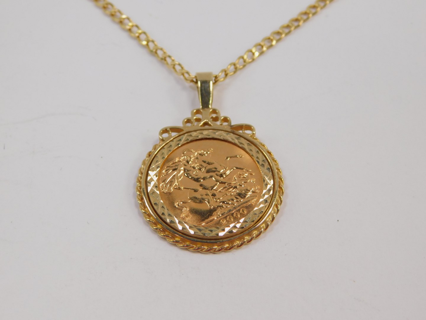 An Elizabeth II gold half sovereign 2000, 9ct gold pendant mounted on chain, 8.2g. - Image 2 of 4
