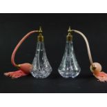 A pair of Stuart cut glass atomisers decorated in the Fuchsia pattern, 16cm high.