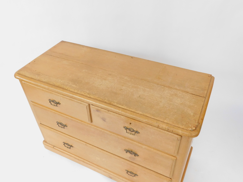 A Victorian pine chest, of two short over two long drawers, raised on a plinth base on castors, 75.5 - Image 2 of 3