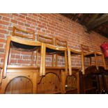 A set of four utility furniture oak framed dining chairs, marked CC Controlled Commodity.