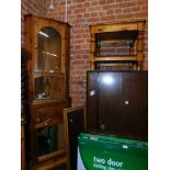 A pine corner cabinet, pine television stand, two pine mirrors, and a square pine occasional table.