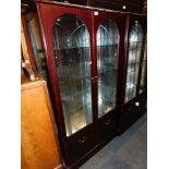 A mahogany effect display cabinet, enclosing three glass shelves, 167cm high, 90cm wide, 38cm deep.