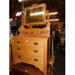 An early 20thC style blonde oak dressing table, with a swing frame mirror, above three drawers, 173c