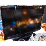 A Samsung DVB 36 inch colour television, in black trim with wire and remote control.