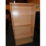 A beech effect bookcase, enclosing three adjustable shelves, 181cm high, 90cm wide, 35cm deep.