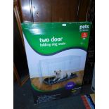 A Pets At Home two door folding dog crate, boxed, unopened.