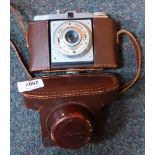 A Digna camera, with 1:80mm lens, in brown leather case.