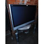 A Panasonic 42" LCD television, model no TH-42PX60B, with glass stand. (2)