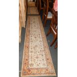 A Royal Keshan wool runner, beige ground, 68cm x 274cm, together with a pair of matching smaller run