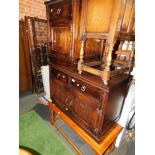 Two dark oak side cabinets, together with an oak coffee table, (3)