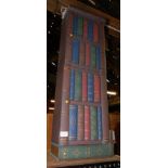 A DVD cabinet, formed as a stack of books, 94cm high, 29cm wide, 21cm deep.
