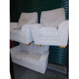 A three piece suite upholstered in grey striped fabric.