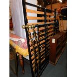A Victorian style black painted double bed frame.