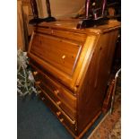 A pine bureau, 110cm high, 86cm wide, 44cm deep.