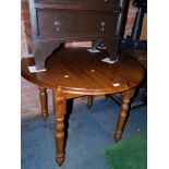 A circular pine kitchen table, 73cm high, 93cm diameter.