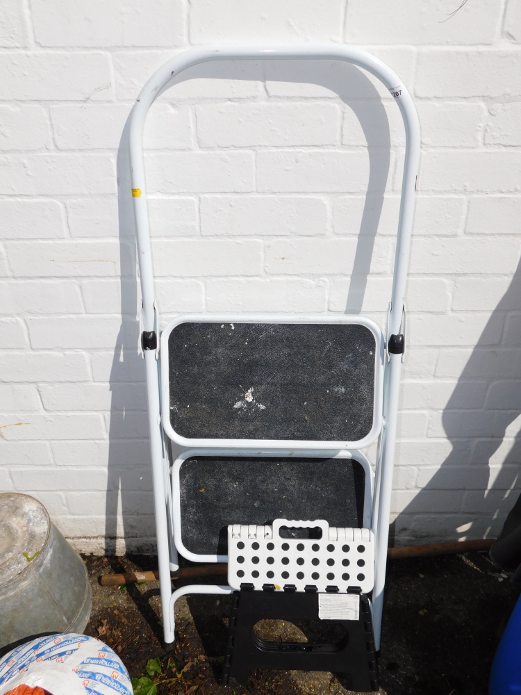 A folding metal framed step ladder.