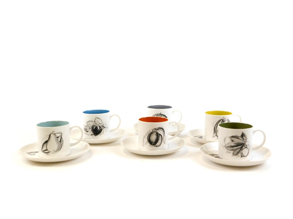 A set of Susie Cooper multicoloured coffee cans and saucers, each with designs of fruits with varyin