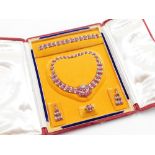 An Indian wedding jewellery suite, comprising necklace, bracelet, earrings and ring, each set with