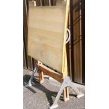A vintage artist drawing board, in a teak overall finish on metal legs, with angled back to tilt as