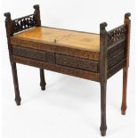 A 19thC Middle Eastern style carved hall seat, with marquetry inlaid hinged seat/lid to the locker c