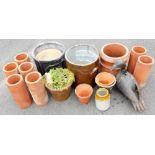 A group of garden pots and ornaments, to include terracotta turrets, a stoneware jar, various terrac