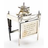 An early George V silver ink stand of neo classical design, having a raised inkwell on a four leg st