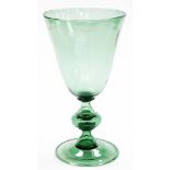 A Victorian green glass goblet vase, with flared rim on a stepped base, 34.5cm high, the bowl 18cm d