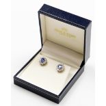 A pair of 18ct gold sapphire and diamond cluster earrings, the central cornflower blue oval cut sapp