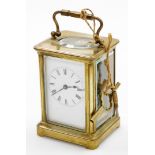 A late 19thC brass cased carriage timepiece, with a rectangular white enamelled dial, with Roman num