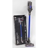 A Dyson CC44 Animal hand held vacuum cleaner, with accessories and wall mounted charging section, bo