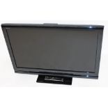 A Sony Bravia 40'' flat screen television, with remote control.