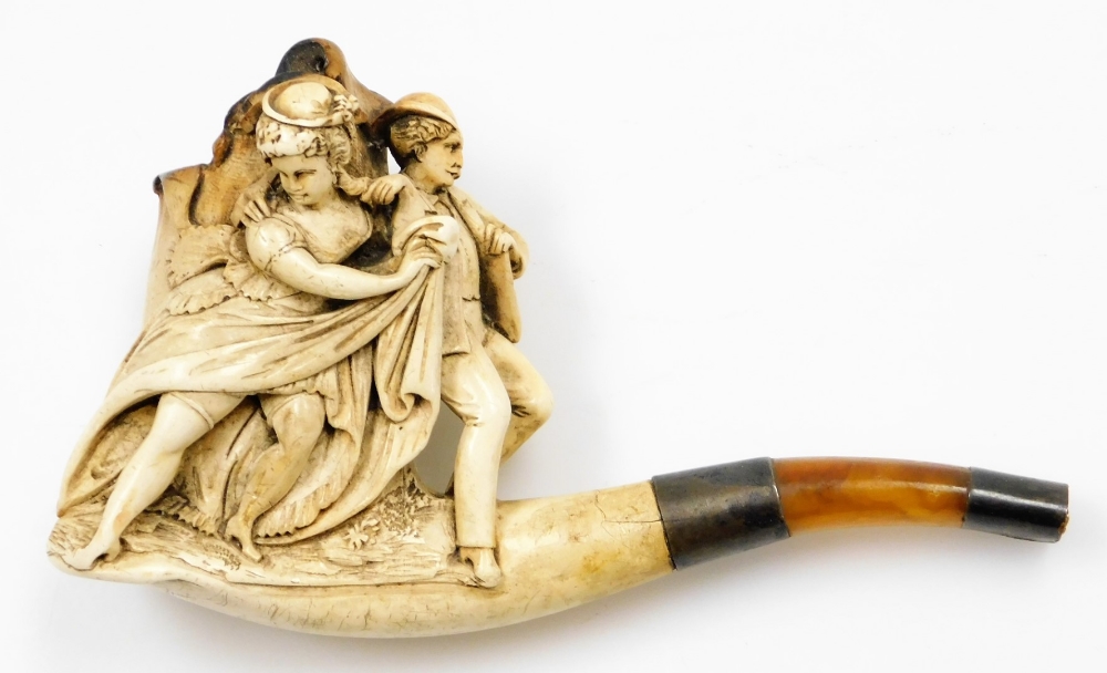 A meerschaum pipe, with silver plated ends, and amber cheroot with decorative three neoclassical fig