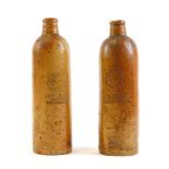 A pair of stoneware bottles, German stamped Georg Kreuzberg Ahrweiler Rheinpreussen, with circular s