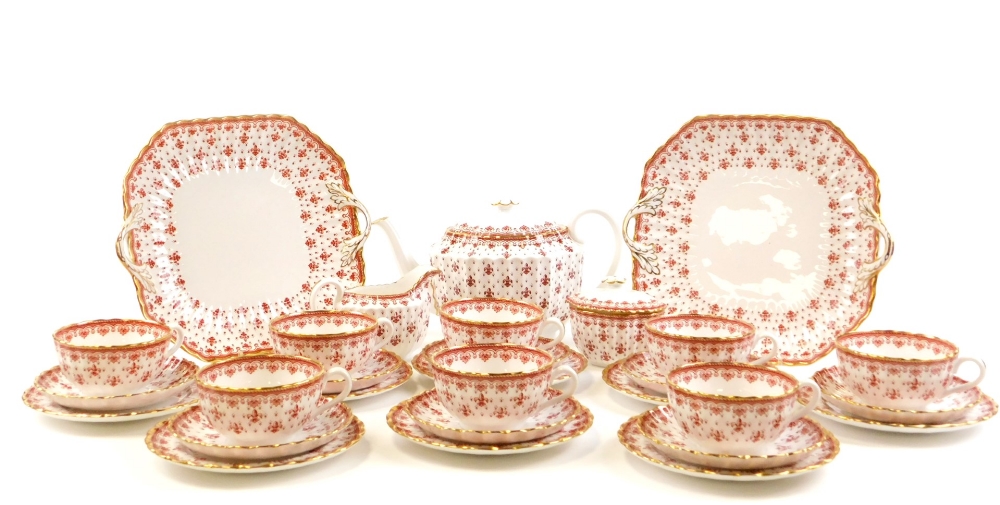 A Spode Fleur De Lys red pattern part tea service, comprising teapot, eight tea cups, milk jug, suga