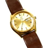 An Omega quartz gents wristwatch, in a gold plated case on a stainless steel back with a gold colour