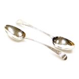 A pair of George III silver table spoons, Old English pattern with rat tails and bright cut decorati