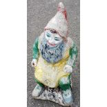 A reconstituted stone painted garden gnome, 67cm high.