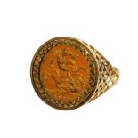 An Elizabeth II half gold sovereign ring, in 9ct gold fret work bordering, the sovereign dated 1982,