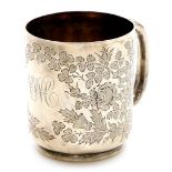 A Victorian silver tankard, with embossed floral decoration, bearing the initials JWC?, London 1890,