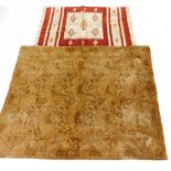 A rug and tapestry, to include a red and cream bordered prayer rug, 112cm x 73cm, and an embroidered